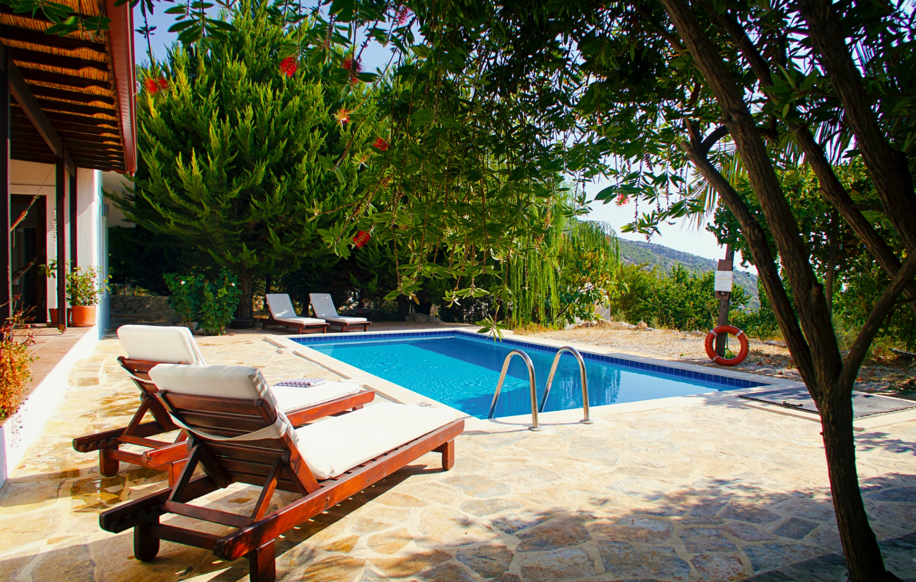 Sun loungers beside the pool